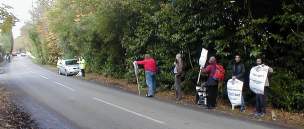 Setting up demo across from the front of the gate