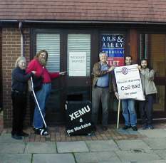 Celebration photo in front of deserted shop in town