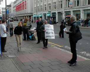 Protesters keeping to their side of the pavement.