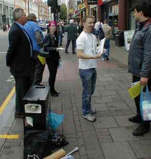 Clam distributing leaflets while deftly standing on our toes