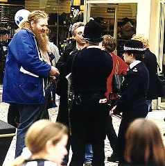 Xemu and Roland discussing with the police