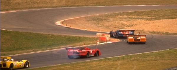 Can-Am cars cominh into corner
after fast straight; JPG 23kB